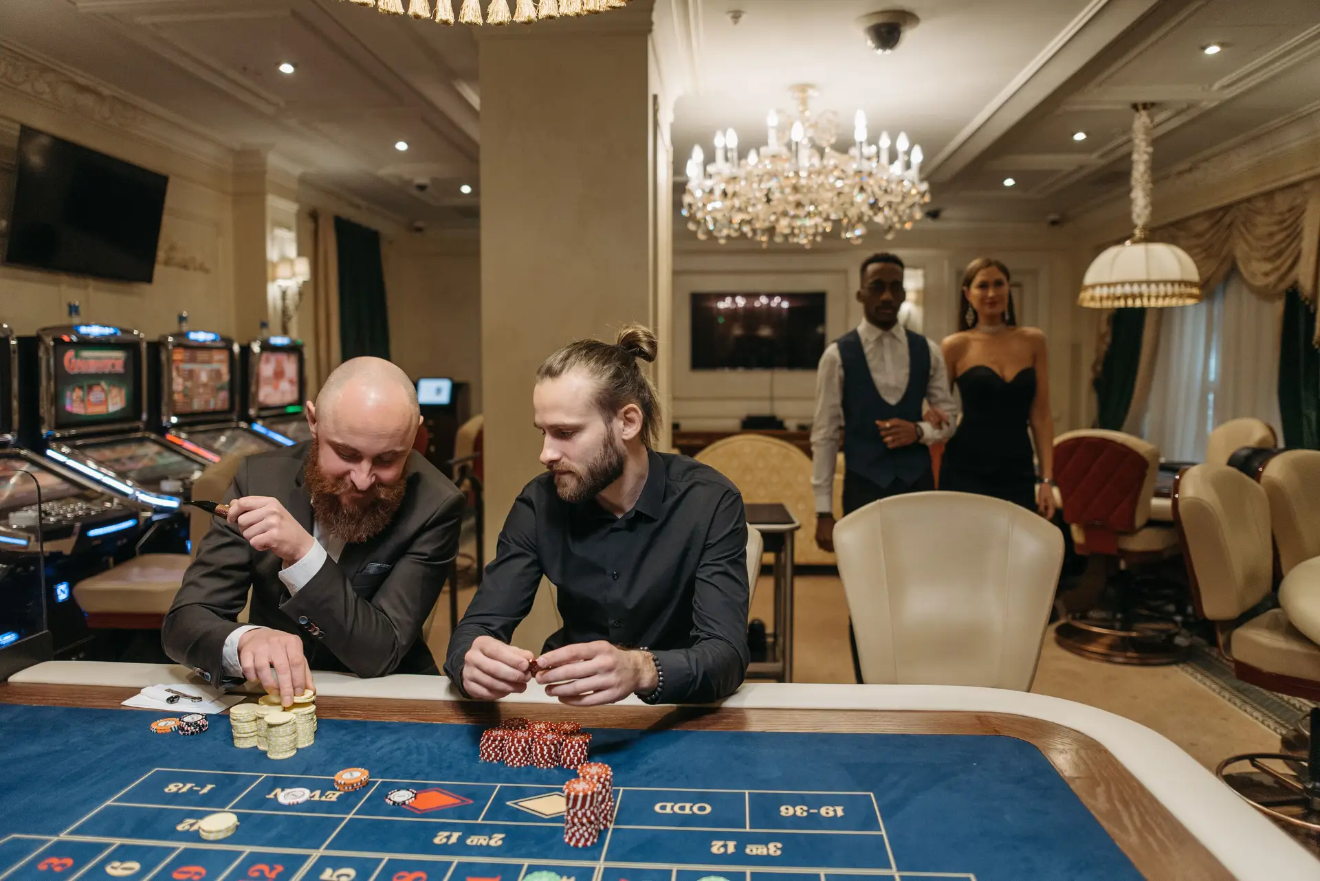 Elegant gamblers at roulette table